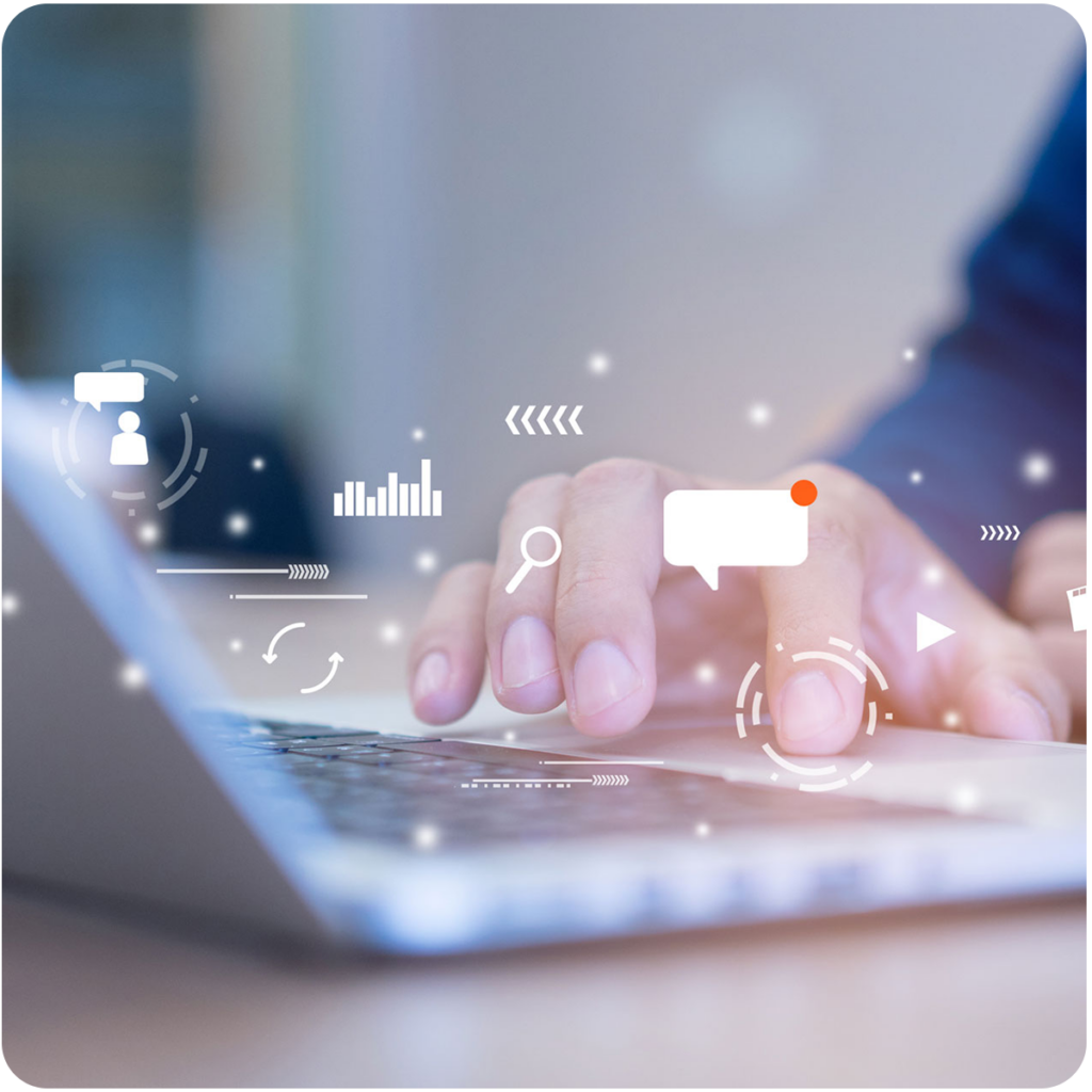Hands on a laptop as they navigate multiple platforms for content marketing symbolized by various icons