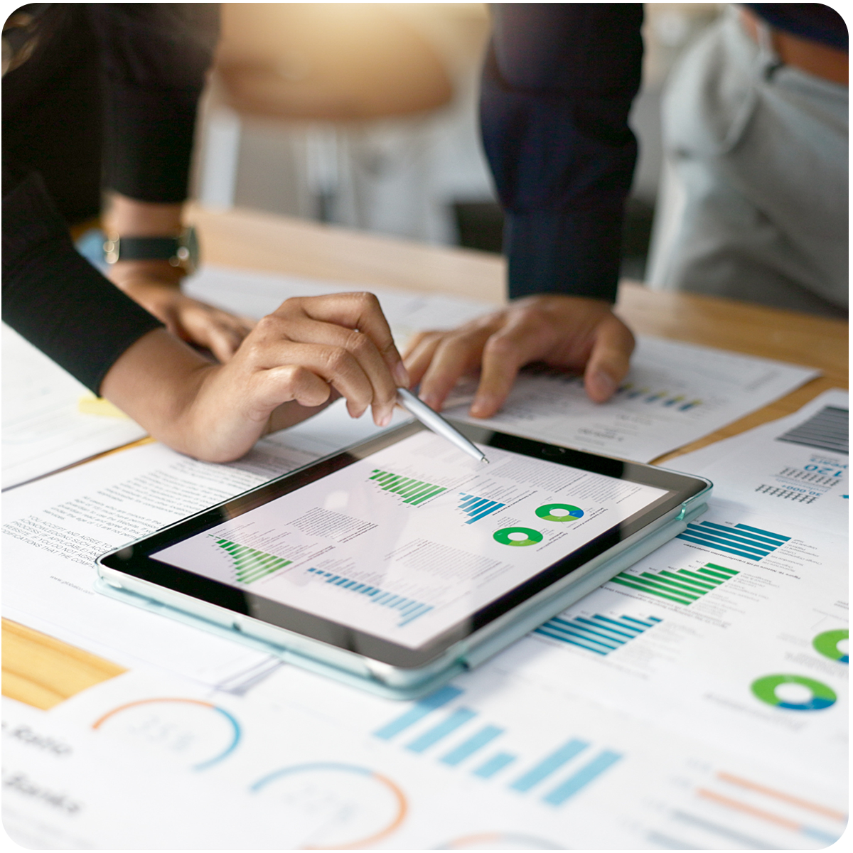 Two young professionals looking over revenue growth charts